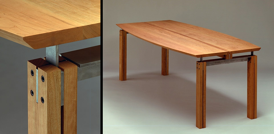 <p>Axis Table</p><p>1992</p><p>Designed as a multi-purpose table for dining rooms or boardrooms. Originally retailed by Living Space in Vancouver. Custom made in many lengths and materials including solid cherry, maple and walnut. In 1999 two 9' long cherry boardroom tables were made for the Canadian Airlines First Class Lounge at the Vancouver International Airport.</p><p>Shown here in solid cherry with cold rolled steel brackets.</p><p>Height 28'' Width 40'' Length 7'-0''</p>